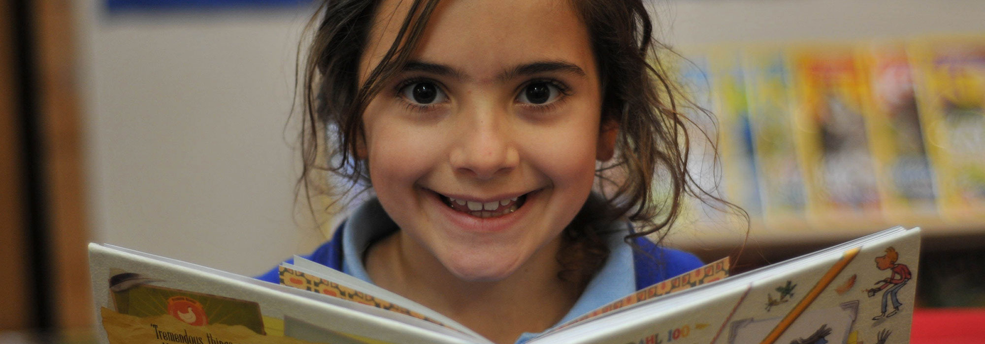 Young girl reading a book